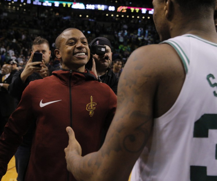 The jacket colors were different but that smile, the one that captivated a city the past two years, was still on Isaiah Thomas' face Wednesday night as he returned to Boston, this time with the Cleveland Cavaliers, and saw old teammates such as Marcus Smart.
