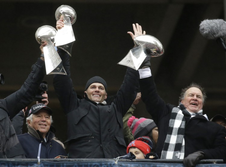 Patriots owner Robert Kraft, left, quarterback Tom Brady and Coach Bill Belichick have been together for five Super Bowl championships and are in contention for another title.