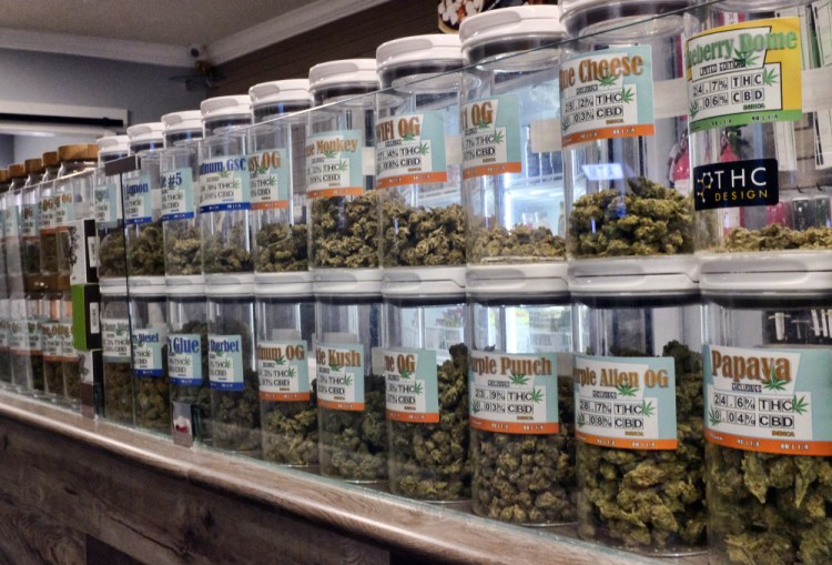 Jars of medical marijuana are on display on the counter of a marijuana dispensary in Los Angeles. All but four states allow some form of medical marijuana.