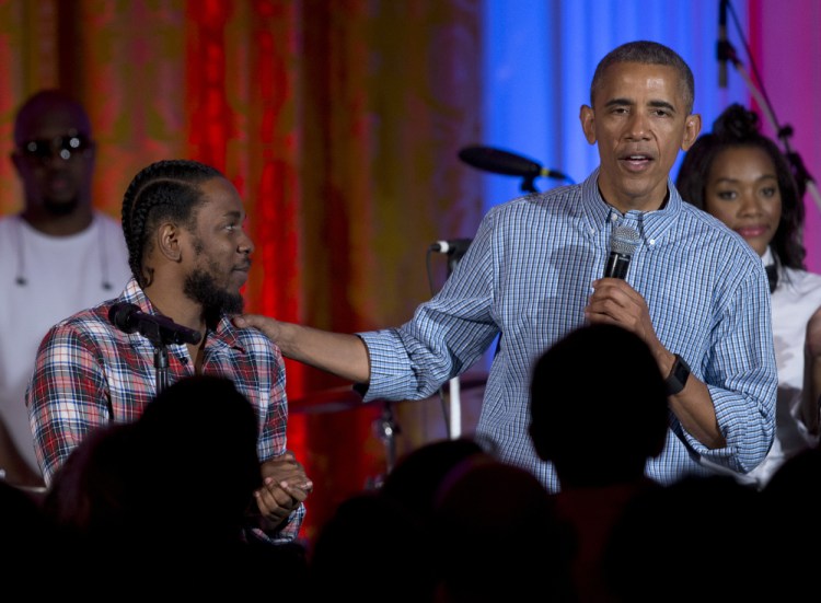President Obama, joined by Kendrick Lamar, speaks during an Independence Day celebration for members of the military and their families, at the White House, in Washington in 2016.