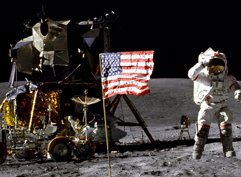 John Young salutes the flag at the Descartes landing site on the moon during the first Apollo 16 extravehicular activity in 1972.