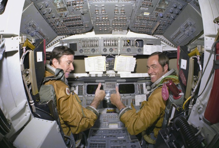 Space shuttle mission commander John Young and pilot Robert Crippen train for a mission in 1980.
