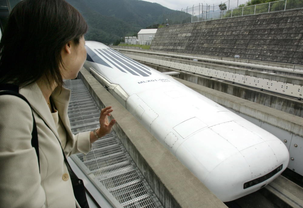 Central Japan Railway Co.'s Maglev train makes a test run west of Tokyo in 2004. Maglev technology uses magnetic forces to lift and propel trains at speeds up to 375 mph.