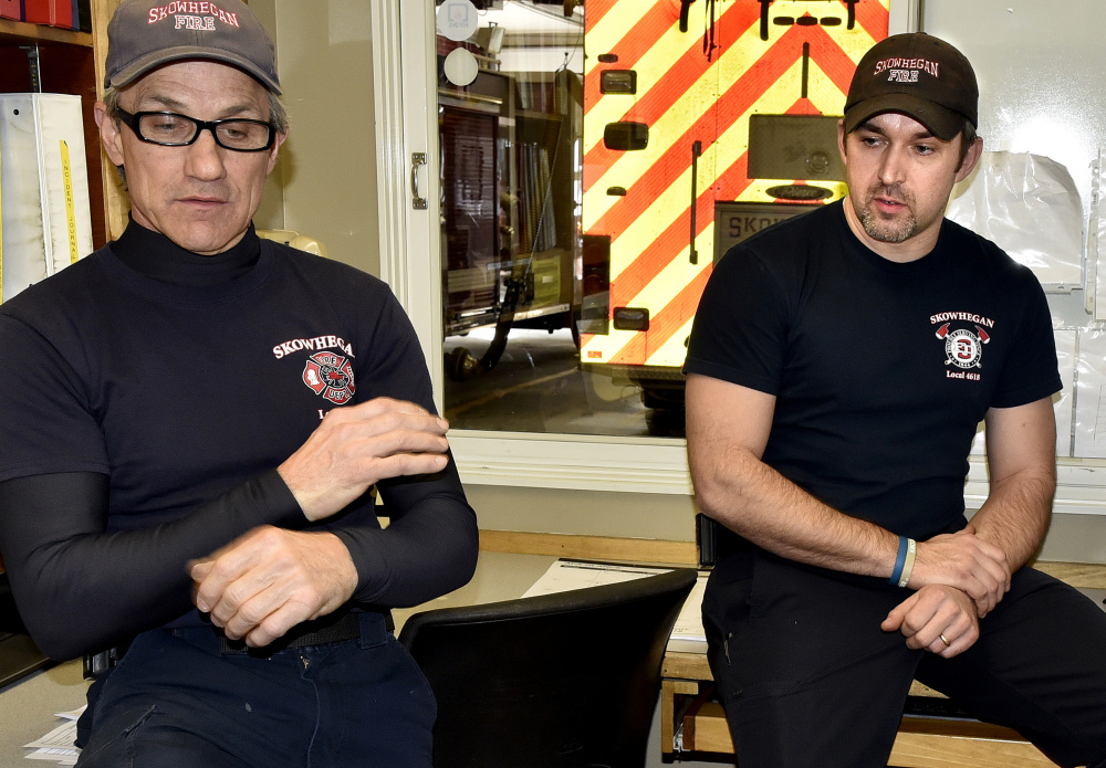 Skowhegan Fire Capt. Rick Caldwell, left, and firefighter Daryl Wyman talk Sunday about discovering the body of William Lashon in his mobile home. "I really think he was just overcome from the heat and the smoke. It appeared he may have tried to put the fire out himself," Wyman said.