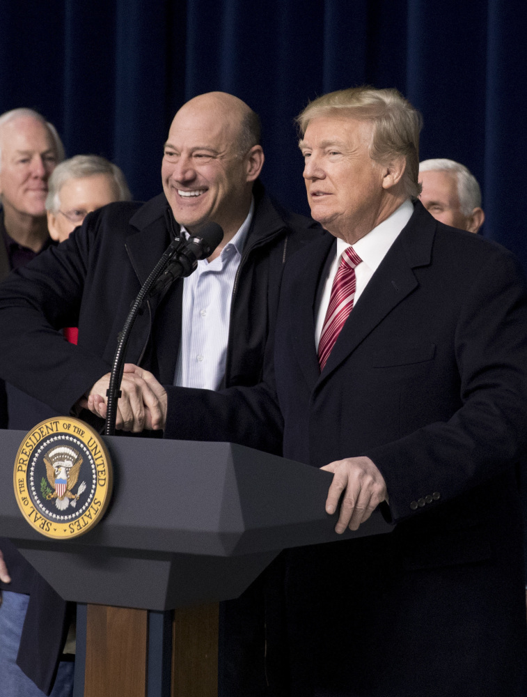 National Economic Council chairman Gary Cohn, left, shakes hands with President Trump, who asked Cohn to come to the podium after being asked a question by a member of the media about their relationship following the Congressional Republican Leadership Retreat at Camp David, Md., on Saturday.