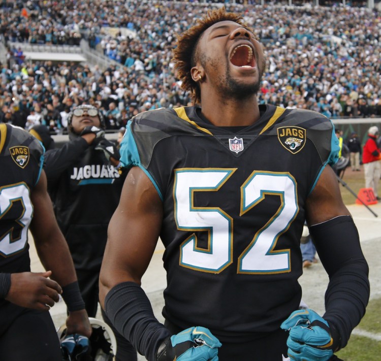 Linebacker Donald Payne celebrates after the Jacksonville Jaguars beat the Buffalo Bills 10-3 in their AFC wild-card game Sunday in Jacksonville, Florida.