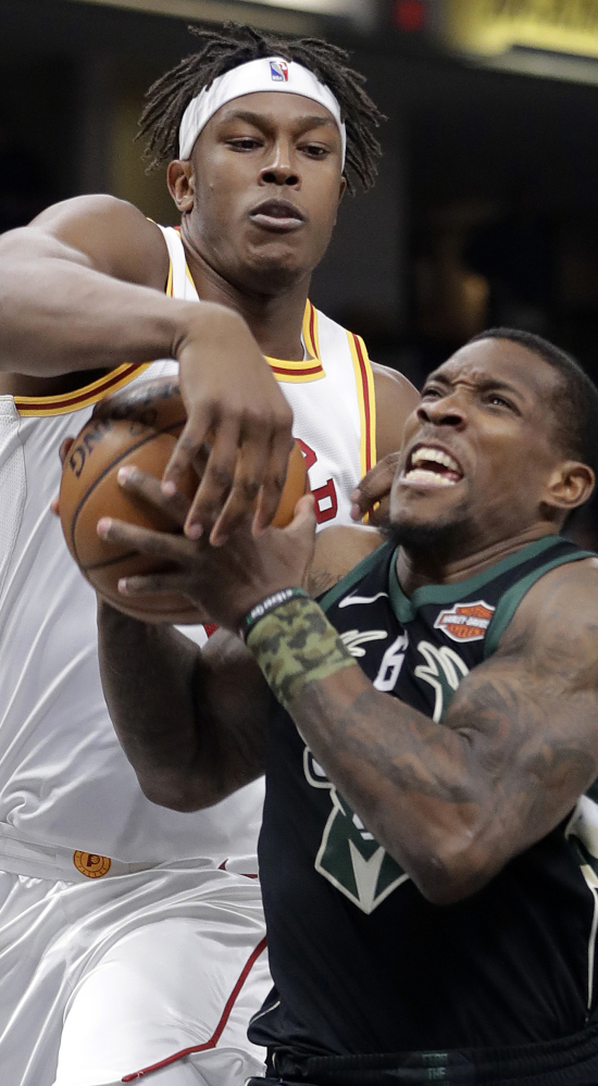 Milwaukee's Eric Bledsoe, right, goes to the basket against Indiana's Myles Turner during the Pacers' 109-96 win Monday.