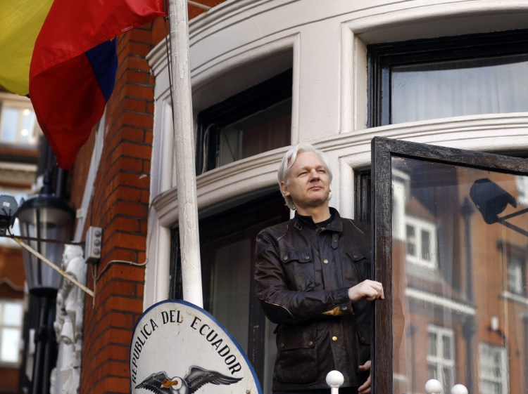 WikiLeaks founder Julian Assange is shown in 2017 greeting supporters outside the Ecuadorian embassy in London. 
