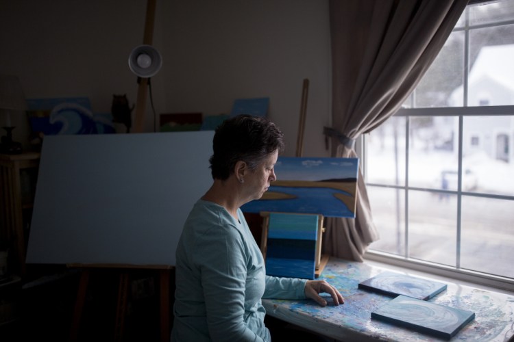 Judy Bullard, a painter who lives in Old Orchard Beach and receives Medicaid benefits, has epilepsy and says the condition prevents her from working regularly.
