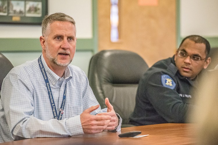 William DeLong, U.S. Department of Homeland Security, talks about active-shooter preparation to members of the Lewiston Auburn Metropolitan Chamber of Commerce as Joe Philippon, right, of the Lewiston Police Department, listens.
