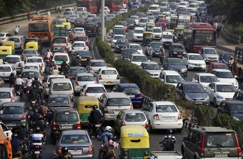 Traffic moves along a highway during morning rush hour in Delhi, India. 