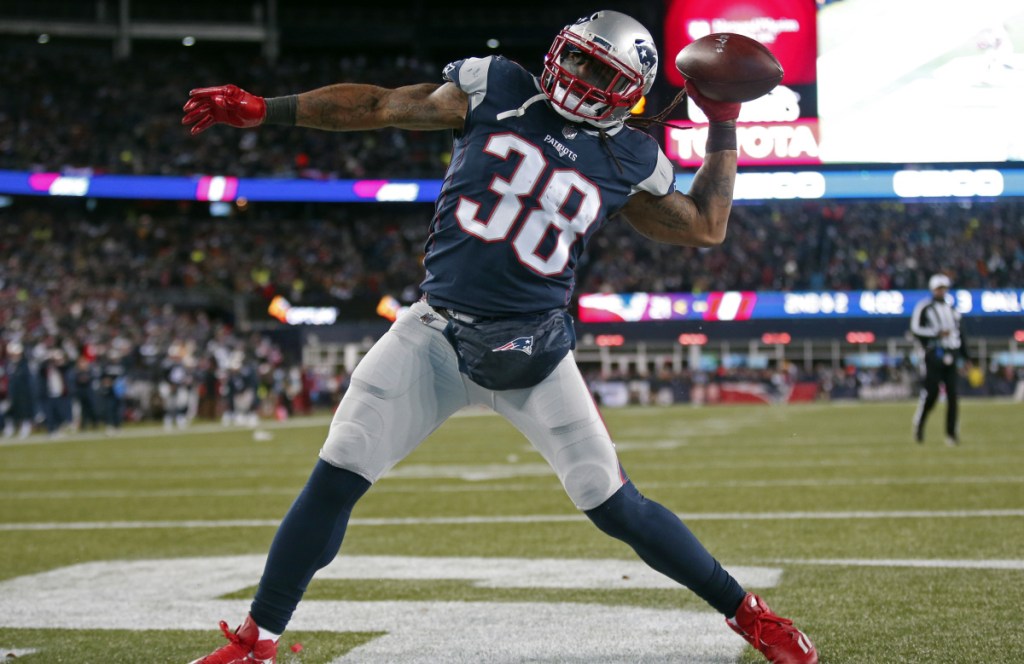 Patriots running back Brandon Bolden celebrates his touchdown run in the fourth quarter. It was the first career playoff touchdown for the six-year veteran, who is more known for his special teams play.