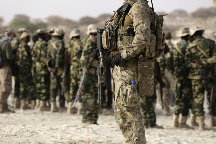 A U.S. soldier leads Chadian troops during a military exercise in 2015. A reader accuses President Trump of adding to the threats faced by U.S. troops in Africa and elsewhere.