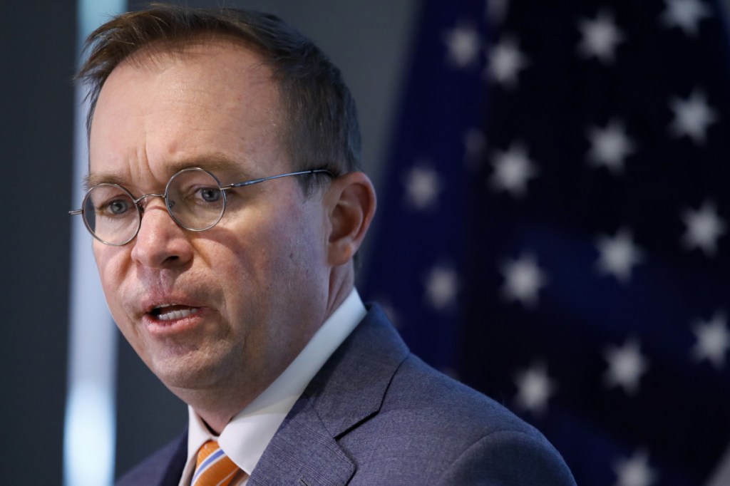 Mick Mulvaney speaks at a news conference in Washington on Nov. 27, after his first day as acting director of the Consumer Financial Protection Bureau. The bureau is reconsidering a key set of rules enacted in 2017 that would have protected consumers against harmful payday lenders.