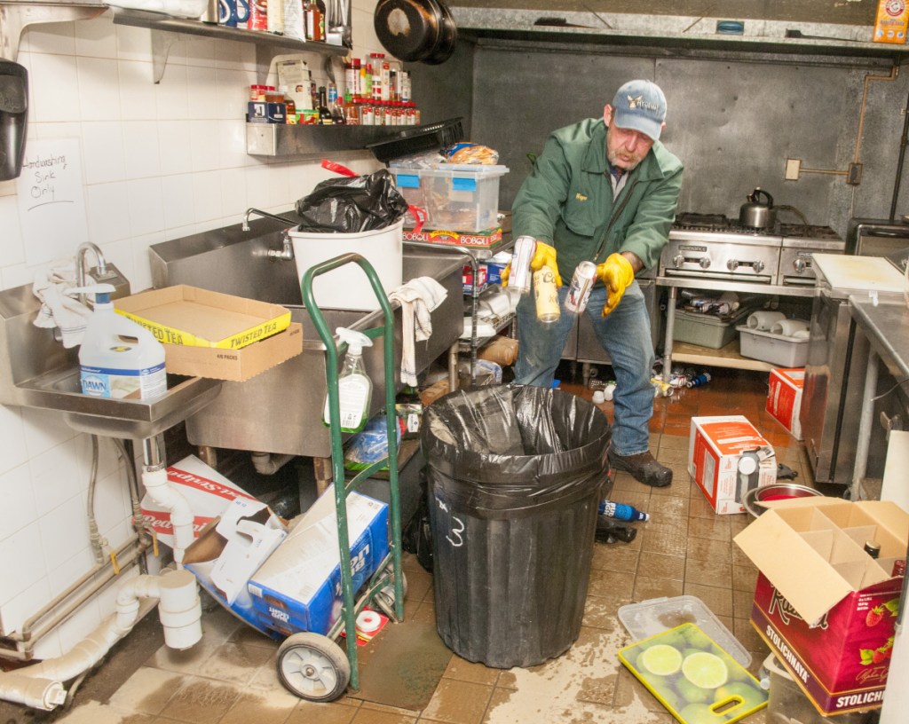 Owner Wayne Hyde cleans up the kitchen of the Hydeout at the Wharf around 9:40 a.m. Tuesday in Hallowell.