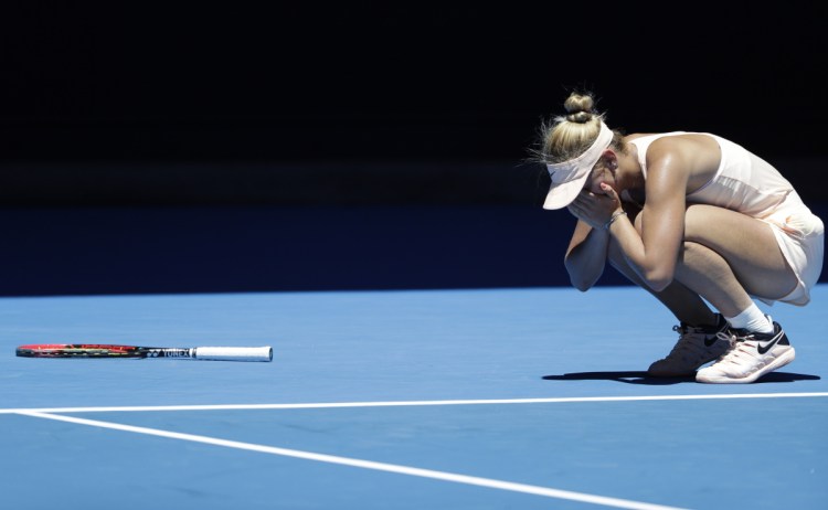 Marta Kostyuk reacts after defeating Olivia Rogowska Wednesday during their second round match at the Australian Open in Melbourne, Australia. Kostyuk handled the pressure of the big stage to advance to the third round despite committing 45 unforced errors.