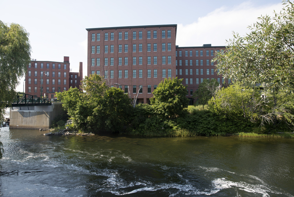 Maine Medical Center is moving the first of about 500 workers to the largest building in downtown Westbrook, One Riverfront Plaza, seen from across the Presumpscot River.