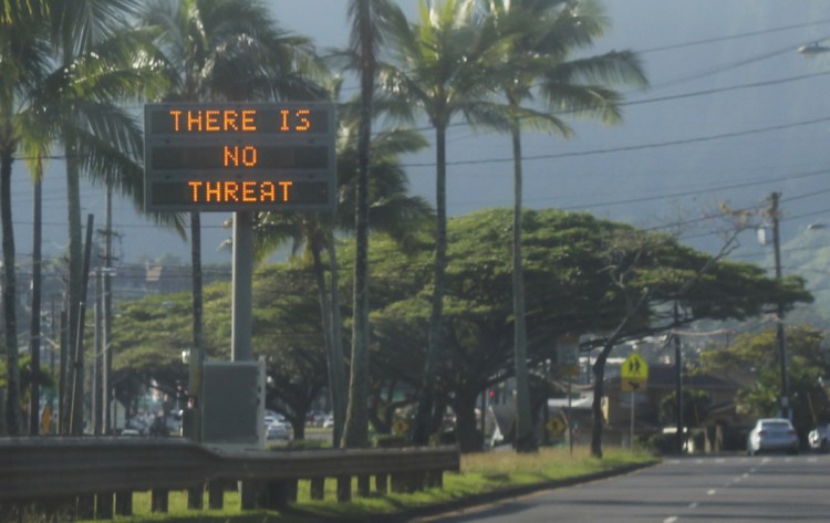 "There is no threat," a highway sign informs drivers in Kaneohe, Hawaii, after a warning about an incoming ballistic missile was issued to residents last Saturday. A reader says the FCC was slow to alert the public about the error.