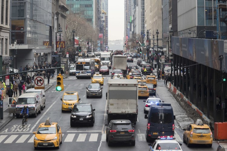 Traffic makes it's way across 42nd Street in New York City earlier in January.