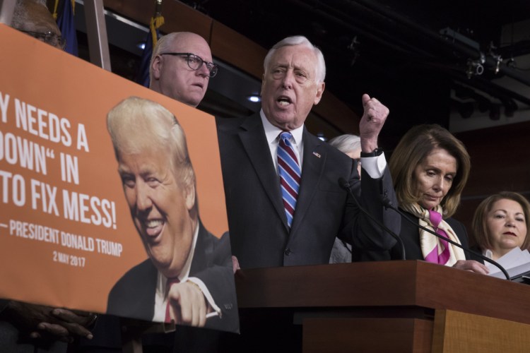 House Minority Whip Steny Hoyer, D-Md., center, joined from left by, Rep. Joseph Crowley, D-N.Y., House Minority Leader Nancy Pelosi, D-Calif., and Rep. Linda Sanchez, D-Calif., speaks at a news conference on the first morning of a government shutdown after a divided Senate rejected a funding measure Friday night, at the Capitol in Washington on Saturday.