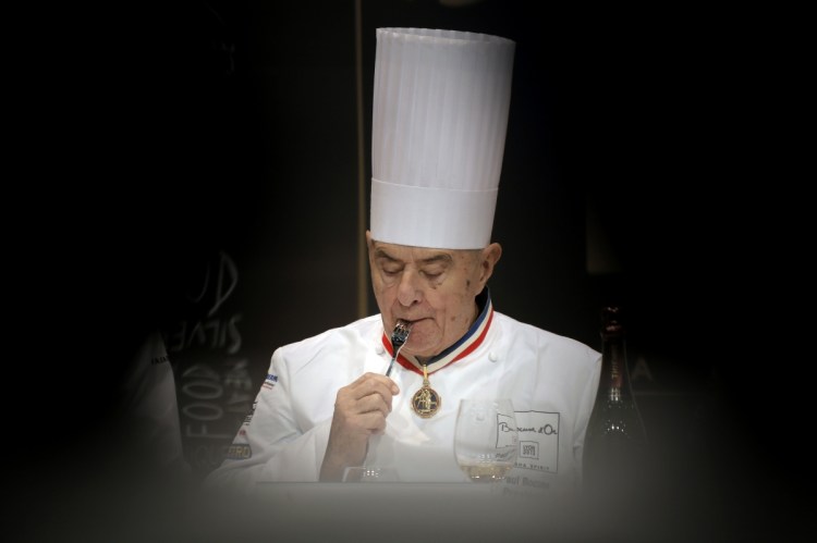 French chef Paul Bocuse tastes a dish during the "Bocuse d'Or" competition at the 14th World Cuisine contest, in Lyon, France. Bocuse has died at 91.