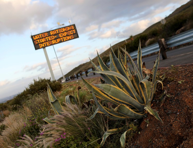 A sign warns residents of water restrictions in Cape Town, South Africa, last fall. Residents are allowed 23 gallons of water per day and after February, it will drop to 13.