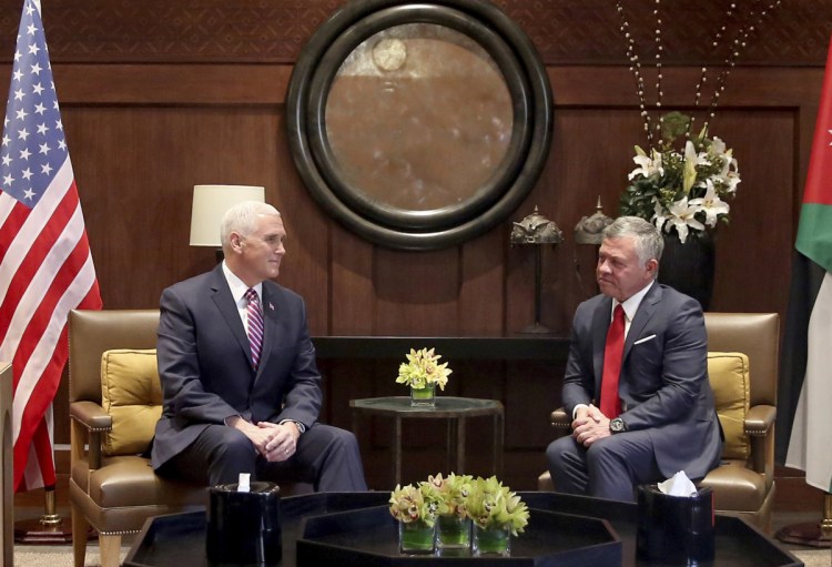 U.S. Vice President Mike Pence, left, meets with King Abdullah II at the Husseiniya Palace in Amman, Jordan, on Sunday.