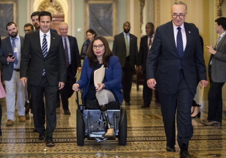 An Illinois Democrat, Sen. Tammy Duckworth, says she took offense to President Trump's weekend tweet accusing Democrats of "holding our military hostage."