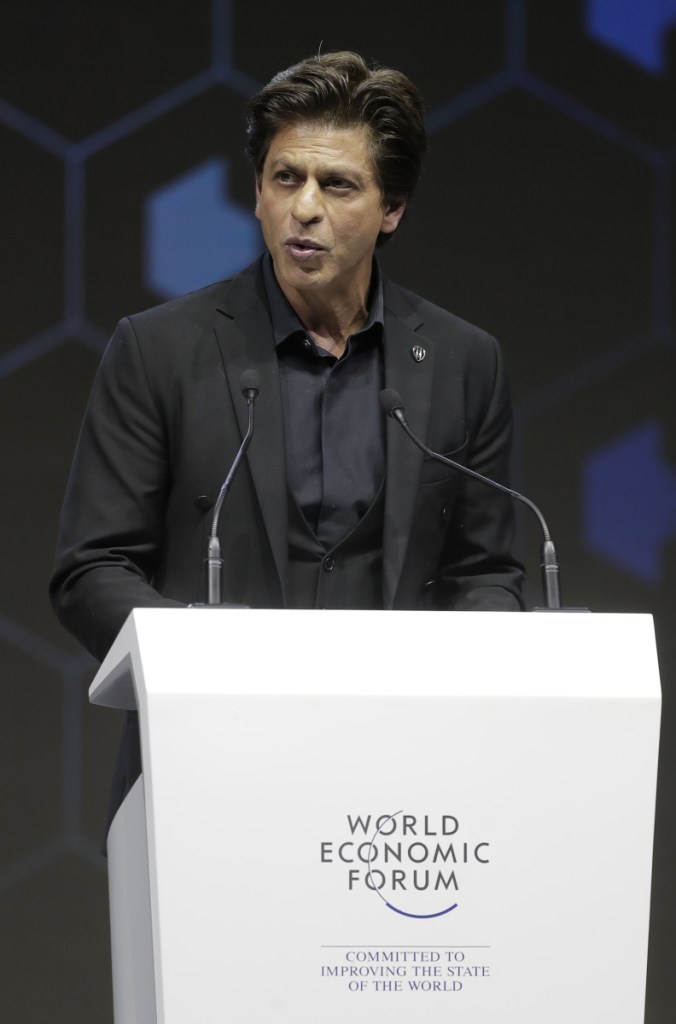 Indian actor Shah Rukh Khan delivers a speech when receiving a Crystal Award during a ceremony on the eve of annual meeting of the World Economic Forum in Davos, Switzerland, Monday, Jan. 22, 2018. The award celebrates the achievements of leading artists who are bridge-builders and role models for all leaders of society. (AP Photo/Markus Schreiber)