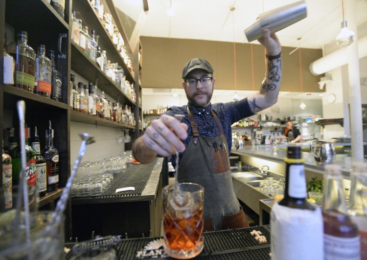 Bartender Ryan Wilmsmeier at work at Portland Hunt and Alpine Club on Jan. 18. Wilmsmeier, who has been through the Safe Bars training, says it gave him more confidence in his ability to handle harassment situations on the job.