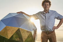 Rocket Lab CEO Peter Beck says the "Humanity Star" next to him, now in orbit, is designed to spin rapidly and reflect sunlight back to Earth.