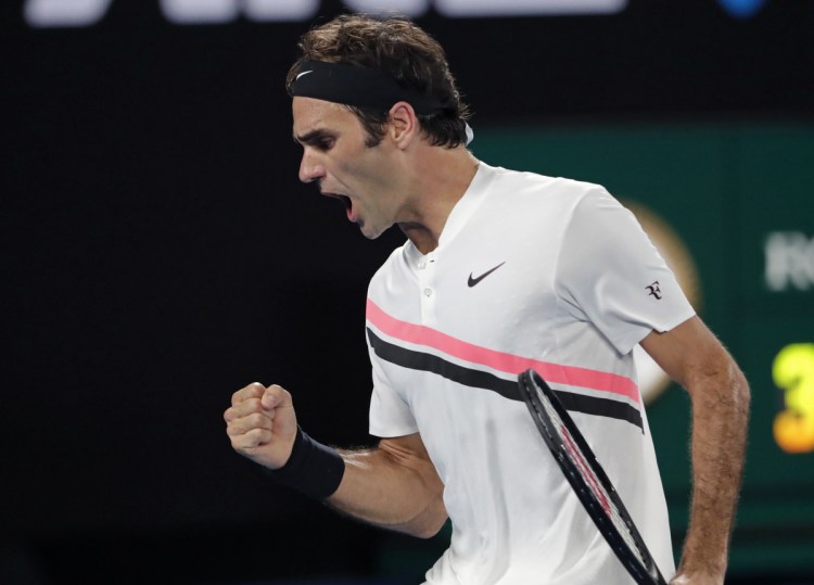 Roger Federer celebrates after winning a point against Croatia's Marin Cilic during the men's singles final at the Australian Open in Melbourne on Sunday.