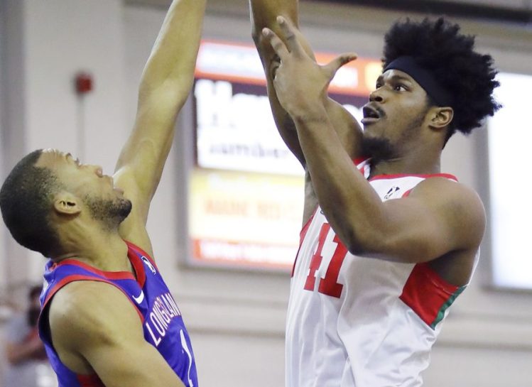 Devin Williams of the Maine Red Claws, taking a shot Sunday over Akil Mitchell of Long Island, has improved his offense to go with an unquestioned rebounding game and solid inside presence.