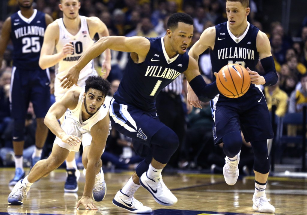 Jalen Brunson of Villanova heads down the court Sunday after stealing the ball from Markus Howard of Marquette during the second half of top-ranked Villanova's 85-82 victory at Milwaukee.