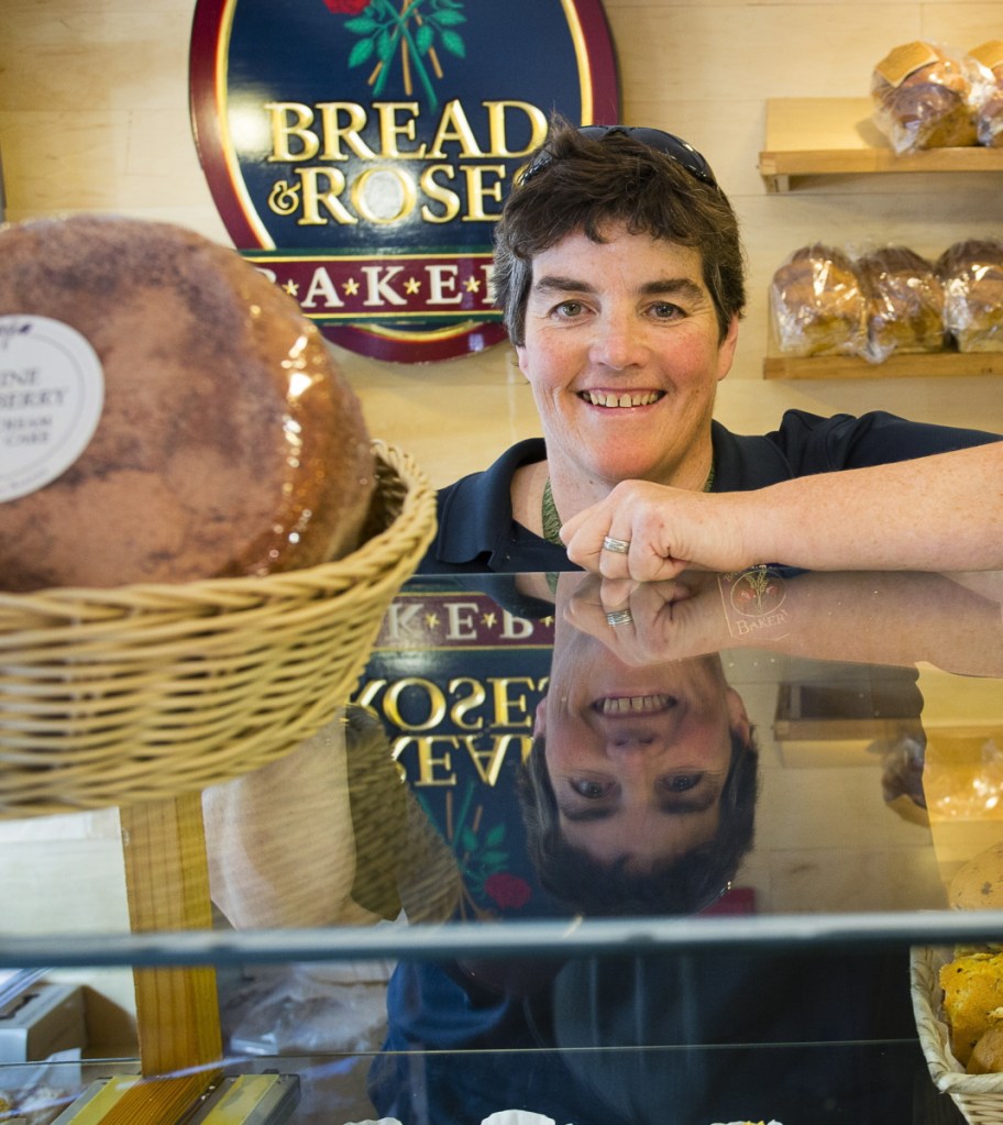 Bread and Roses Bakery owner Mary Breen smiles from over the counter in her Ogunquit shop in 2015.