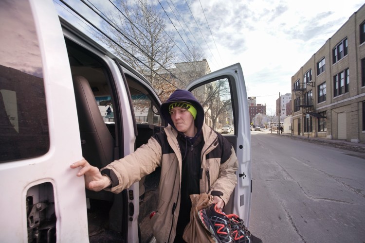 Trish Farr opens the door to a van at Complete Labor in Portland that brings her and her wife, Katie, to a job in Biddeford. The two women started working for Portland Opportunity Crew.