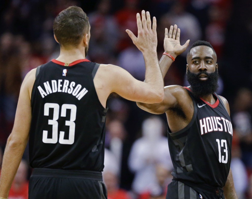 Associated Press/Eric Christian Smith 
 Houston Rockets guard James Harden, right, high-fives Ryan Anderson late in the second half against Orlando on Tuesday. Harden scored 60 points in a 114-107 Houston win