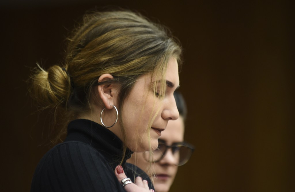 Former gymnast Annie Labrie regains her composure Wednesday, Jan. 31, 2018, while giving her victim impact statement during the first day of statements in Eaton County Circuit Court in Charlotte, Mich., where Nassar is expected to be sentenced on three counts of sexual assault some time next week. Nassar was sentenced to 40 to 175 years in prison in a similar hearing in another county last week. (Matthew Dae Smith/Lansing State Journal via AP)