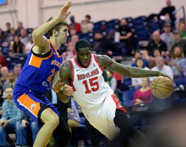 Anthony Bennett of the Maine Red Claws drives to the basket against Luke Kornet of the Westchester Knicks.