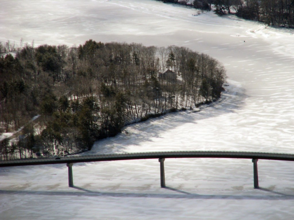 Solid ice around the Kennebec Maine Bridge is seen Wednesday in this image taken by the Coast Guard. The shore seen is  Dresden, at left, and Swan Island, at top.