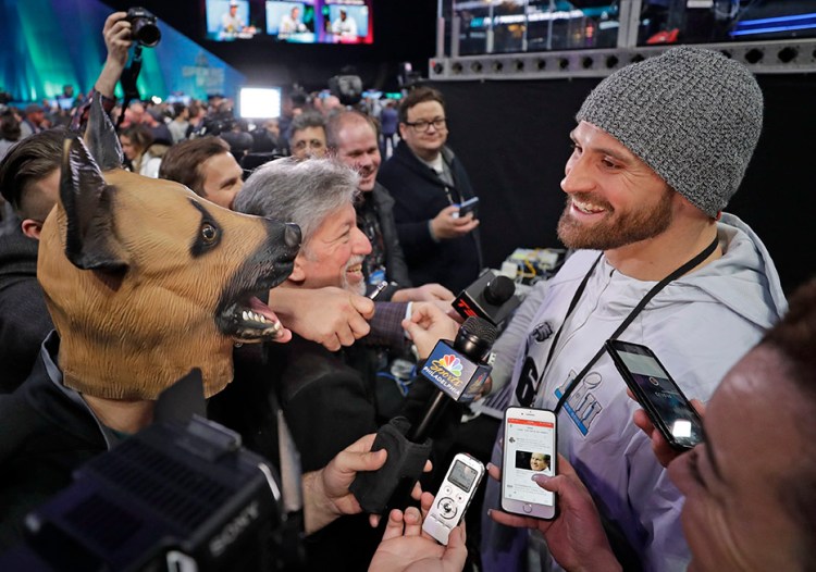 Eagles defensive end Chris Long is interviewed during Super Bowl 52 Opening Night Monday at the Xcel Center in St. Paul, Minnesota. 