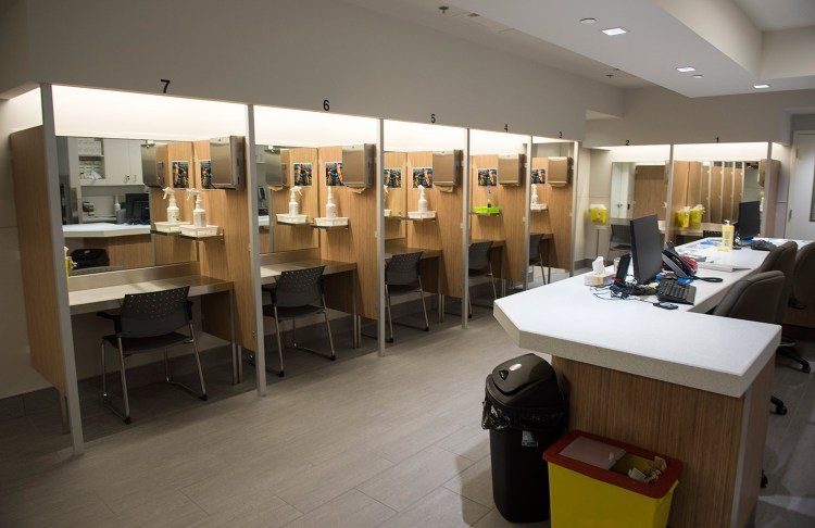  Booths line the Cactus "safe injection site," where drug addicts can shoot up using clean needles, get medical supervision and freedom from arrest, in July in Montreal. The sites are one strategy used in Canada as it tries to counter the high rate of overdose deaths.