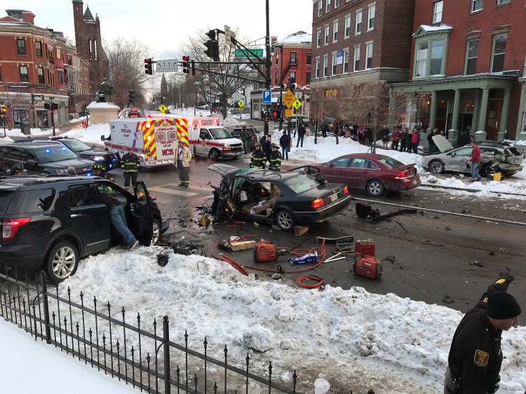 Multiple people were being treated for injuries that were not considered life-threatening after a vehicle crashed into numerous others on Congress Street in Portland on Wednesday.