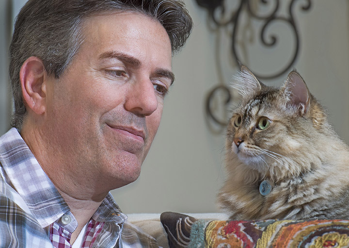Humane Society CEO Wayne Pacelle with his cat, Zoe, at his home in Chevy Chase, Md., in August 2016. 