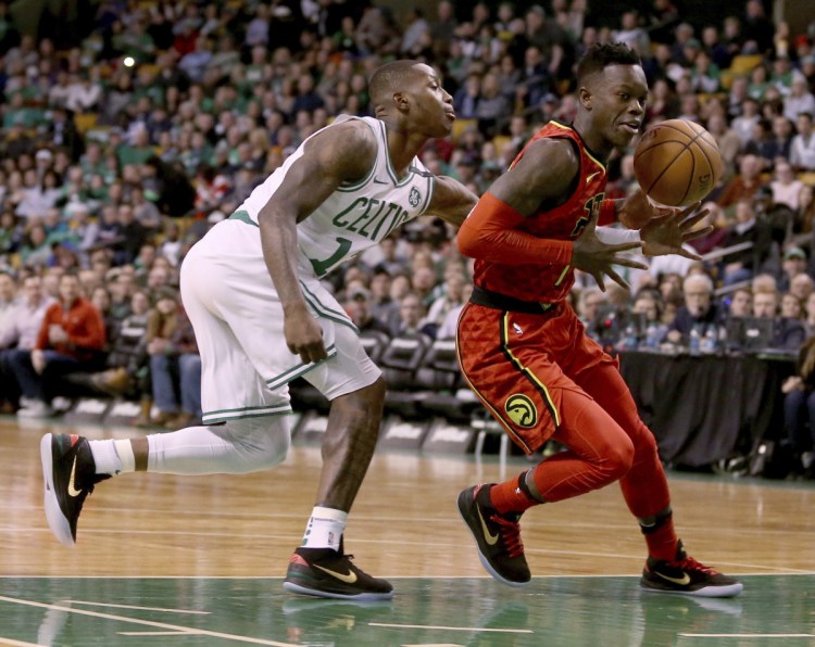 Boston's Terry Rozier knocks the ball loose from Atlanta's Dennis Schroeder in the first half Friday night in Boston.