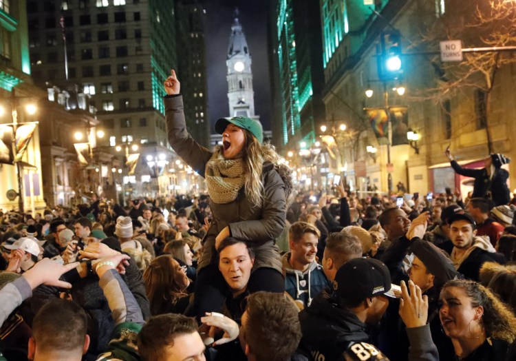 Philadelphia Eagles fans celebrate the team's victory in the NFL Super Bowl 52 between the Eagles and the New England Patriots on Sunday in downtown Philadelphia.