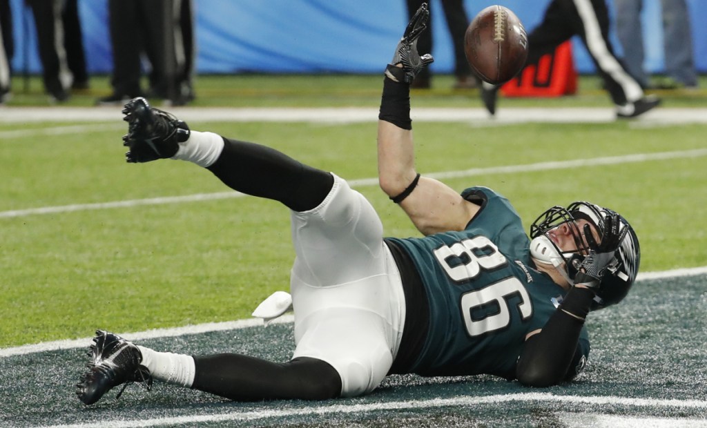 Philadelphia's Zach Ertz losses control of the ball after crossing the goal line to score the go-ahead touchdown Sunday. The play was ruled a touchdown because Ertz had become a runner after completing the catch.