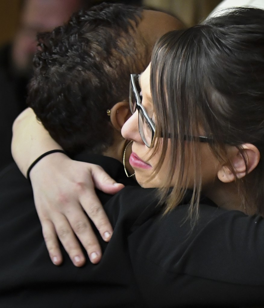 Former gymnast Ashley Erickson hugs assistant prosecutor Robyn Liddell Monday, after the third and final day of Larry Nassar's sentencing in Eaton County Court in Charlotte, Mich.