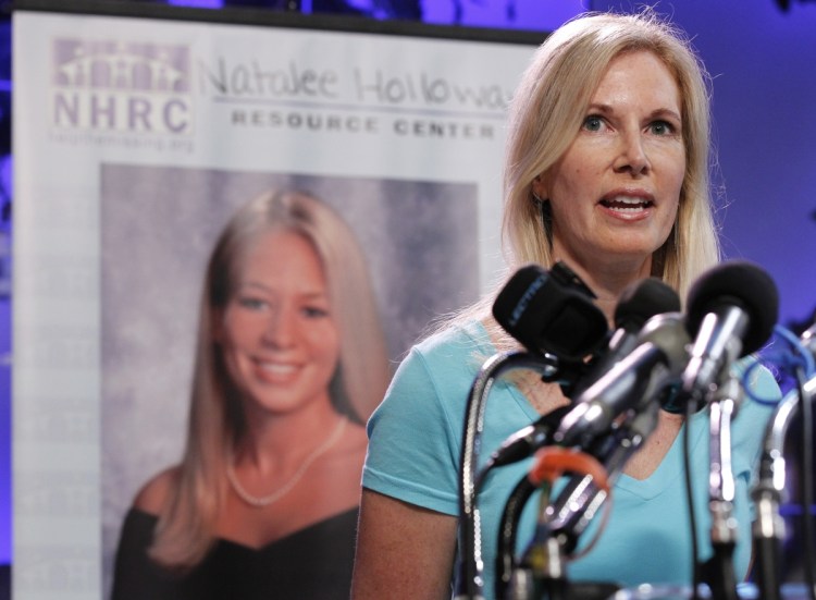 Beth Holloway, mother of Natalee Holloway, the teen missing since a trip to Aruba in 2005, has sued producers of a television show about her disappearance.