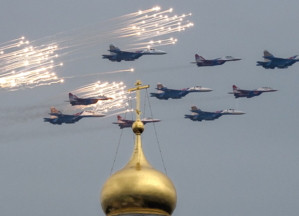 Fighter jets release anti-missile flares as they fly over the Ivan the Great Bell Tower of the Kremlin in 2009.